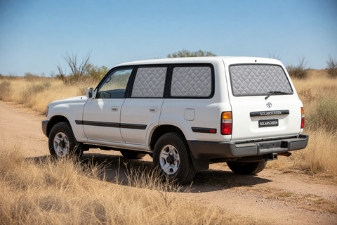 Toyota Landcruiser 80 Series GXL Touring Set with silver insulated screens on rear passenger, fixed cargo and tailgate windows, with front windows clear.