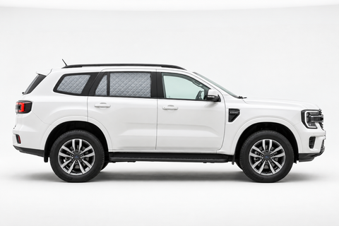 White Next-Gen Ford Everest side profile with silver quilted rear Touring screens and clear front glass.